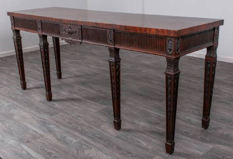 Adam Style English Mahogany Huntboard: 19th Century Adam style English mahogany huntboard having a single board slab top over a fluted apron and a central single drawer with relief carvings of urn, swags and flowers; decorations of bellflo