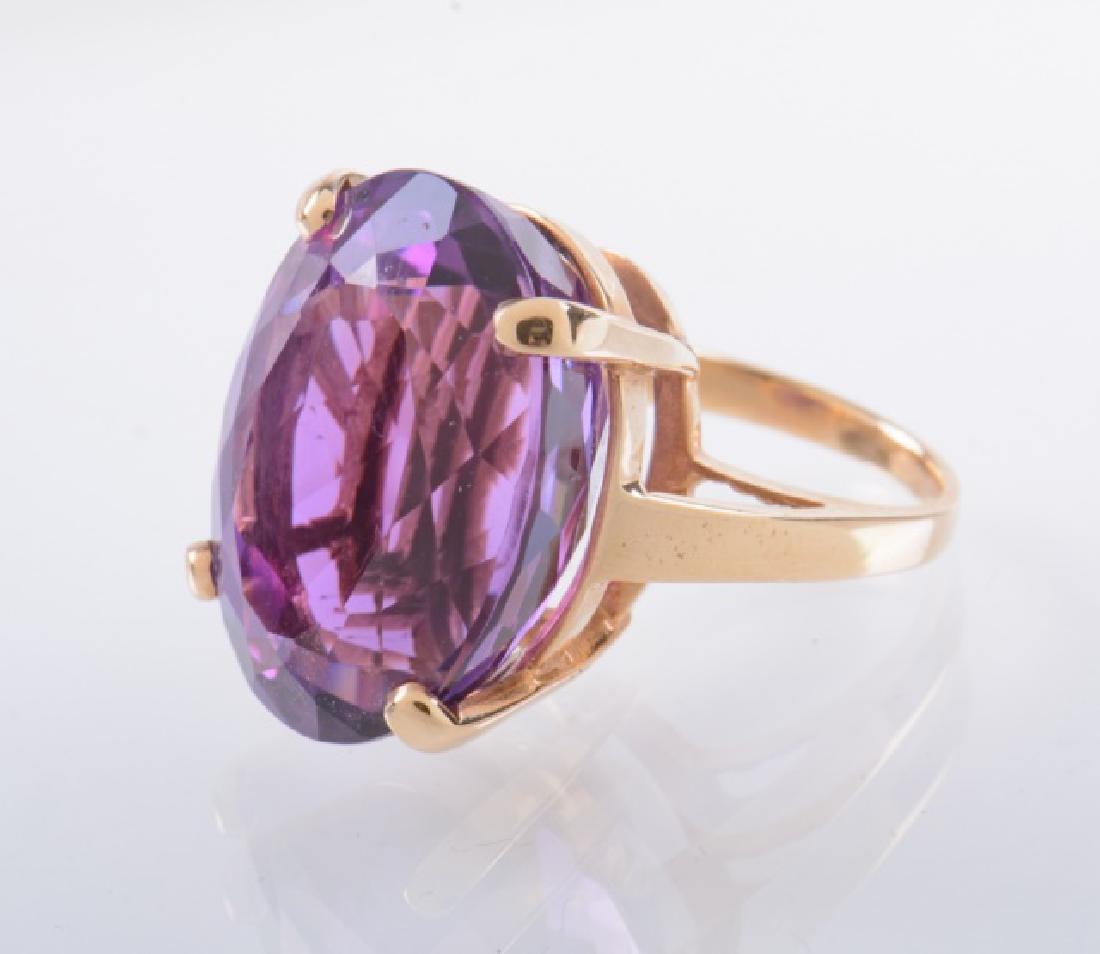 31 ct Amethyst and Gold Ring.: 31 ct by formula amethyst and gold ring. Size 5-1/2. Stamped 14K. Approximate weight 0.44 ozt.