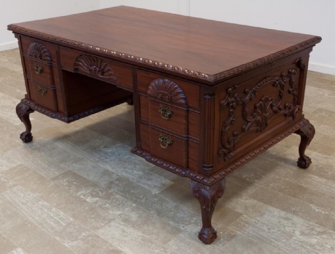 Victorian Style Mahogany Partners Desk: Mahogany Victorian style partners desk having a gadrooned edge to the top with relief and intaglio carved scalloped shells to the three top drawers on each side, and block fronts to the four other dra
