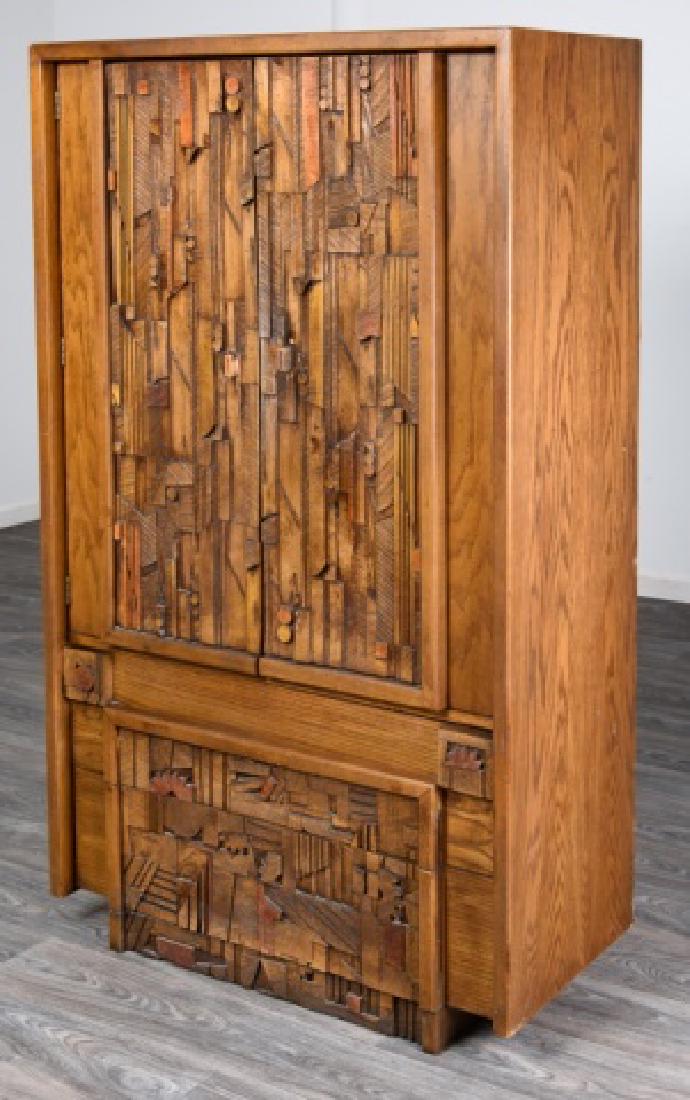 Lane Paul Evans Inspired Brutalist Dresser: Paul Evans inspired dressing cabinet of mixed woods and having an abstract dimensional carved front with two doors to the top opening to reveal two shelves over two open front drawers, and having two