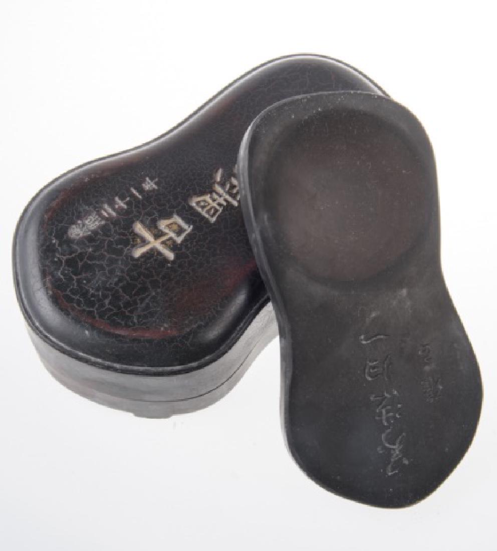 Engraved Chinese Inkstone: Engraved Chinese inkstone resting in an engraved top box. Measures approximately 8-5/8" high, and 5-" wide.