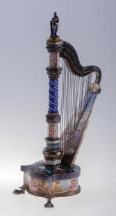 Bohm Viennese Silver & Enamel Harp-Form Clock: Viennese late 19th Century harp-form silver-gilt metal and enamel diminutive clock by Hermann Bohm with a scantily clad female soldier with sword and shield finial to harp form mounted to shield form