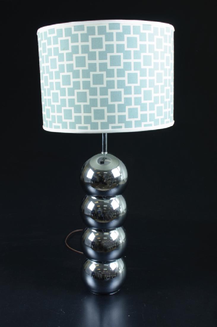 George Kovacs Stacked Chrome Ball Lamp: George Kovacs stacked chrome ball table lamp, unsigned. At the time of cataloging lamp in good working condition. Measures 31-1/2" in height to finial and shade with width of 6" while shade diameter i