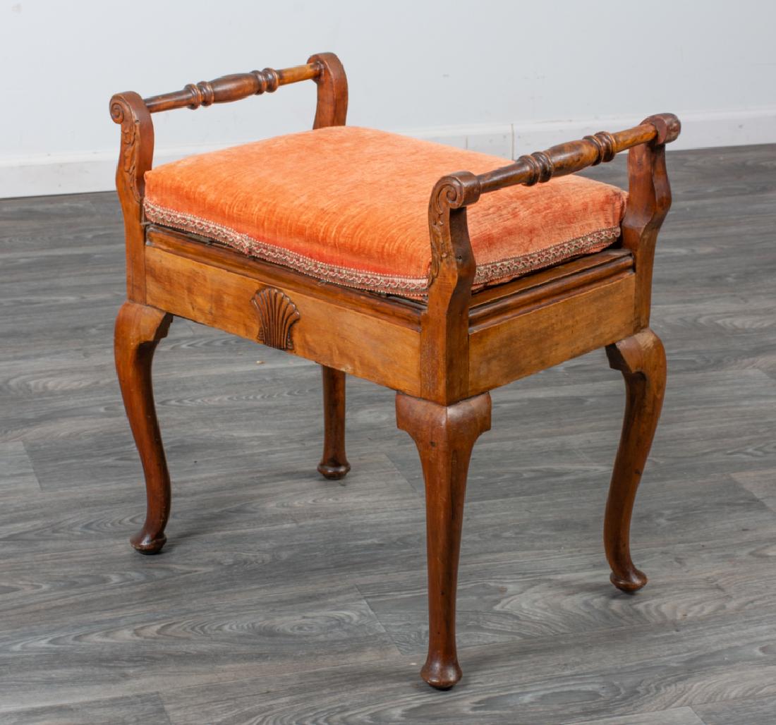 French Walnut Dressing Table Bench: French walnut dressing table bench having a velvet upholstered top, scrolled arms, acanthus carvings, scalloped shell carvings to the seat rails, and cabriole legs ending in pad feet. In overall good
