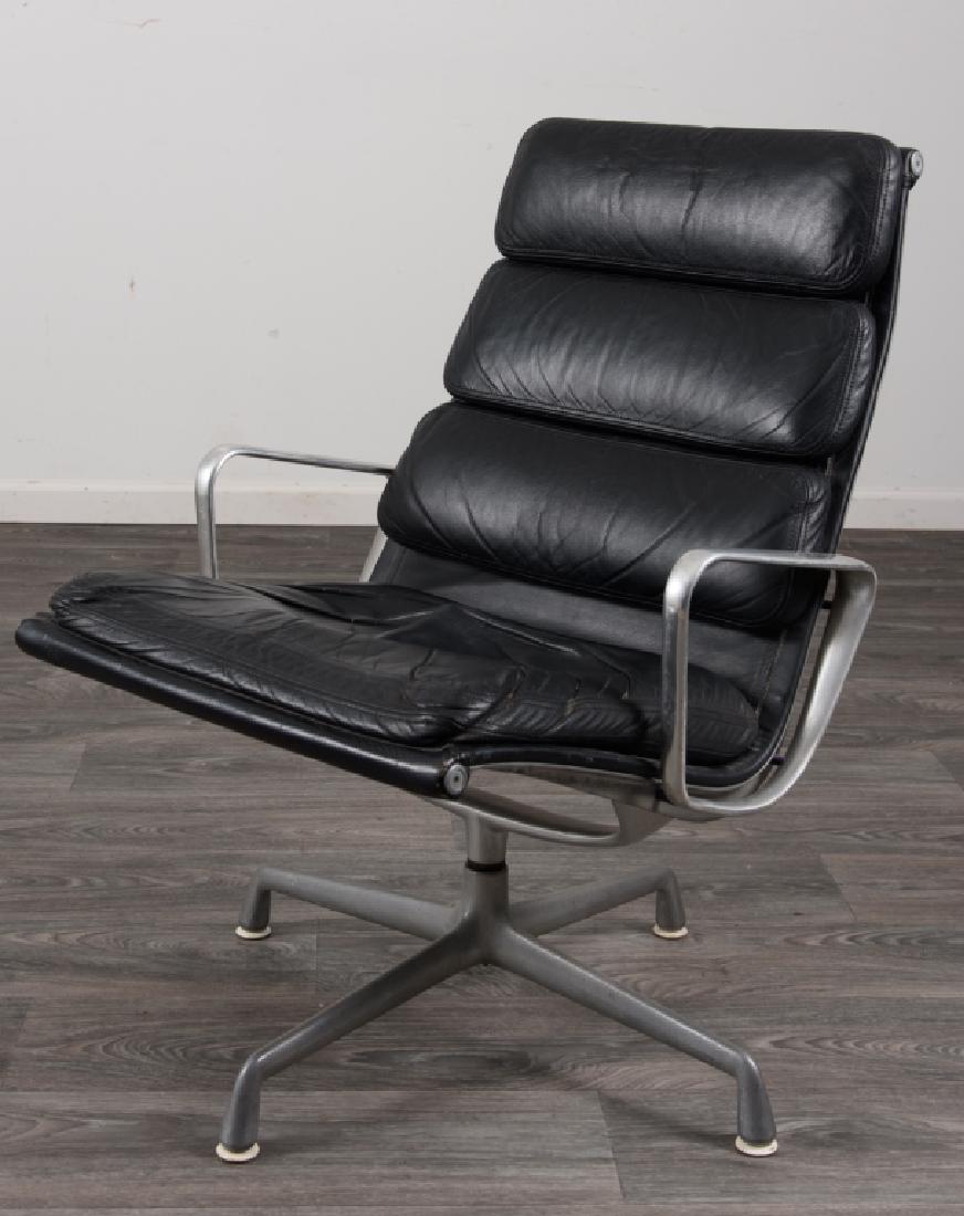 Herman Miller Leather Chair: Herman Miller padded black leather upholstered chair having a cast aluminum base. Marked Herman Miller. In overall good condition consistent with age and use. Measures 35" high, 24-7/8" wide with a se