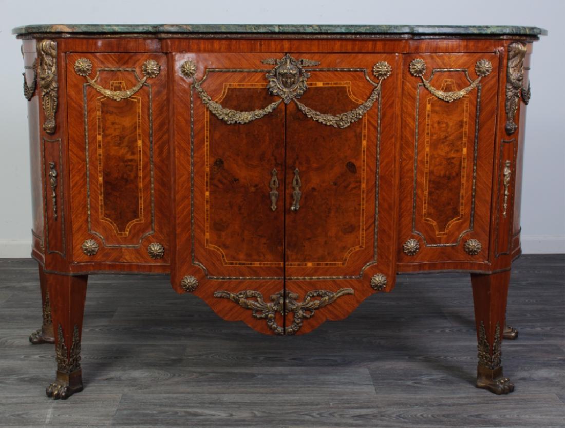 Louis XVI Style Marble Top Sideboard: Louis XVI style sideboard having a shaped green marble top over quartered veneer surrounding burl wood panels bordered by band and string inlay, and a block front with serpentine sides with heavily or