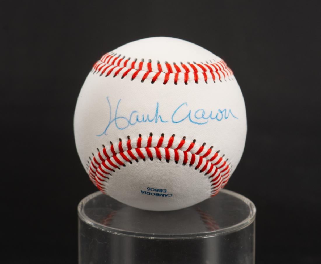 Hank Aaron Autographed Baseball: Hank Aaron autographed Rawlings Official CROLB League baseball, unused. At time of cataloging ball in overall good condition.