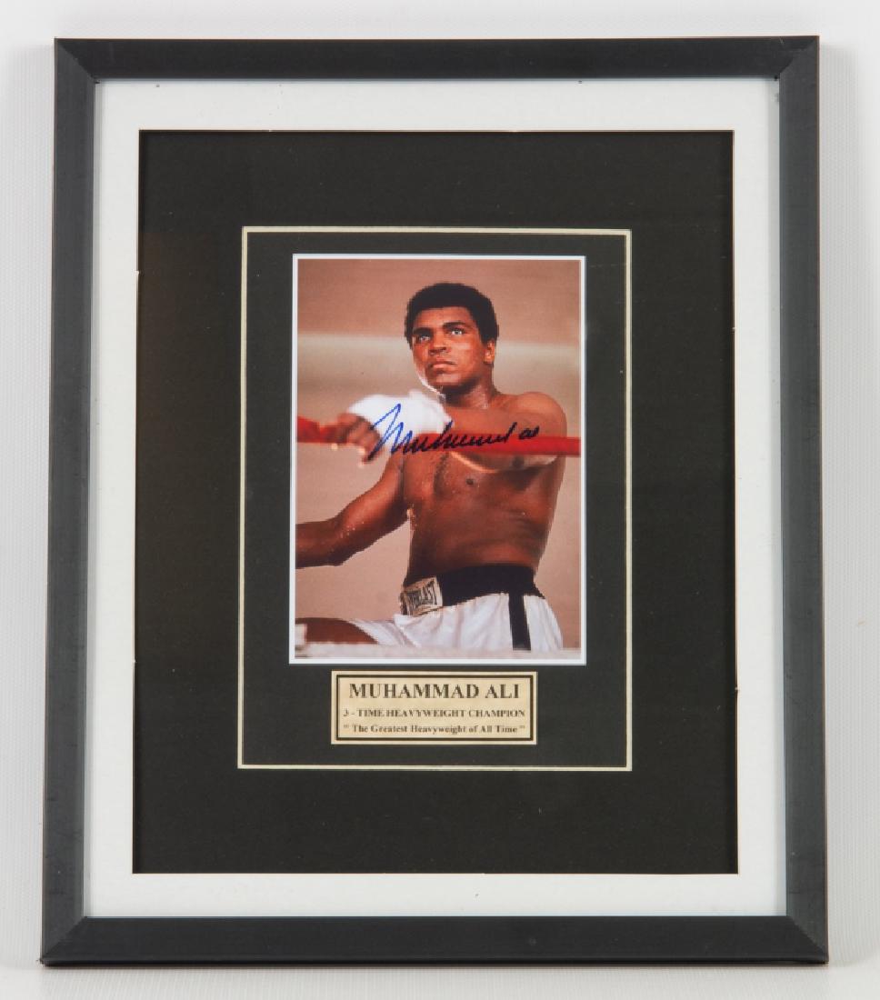 Muhammad Ali Signed Photo: Muhammad Ali three time heavyweight champion, "The Greatest Heavyweight of All Time" photo. Hand signed. Measures 11-1/4" in height by 9-1/4" in width with the sight image measuring 5" in height by 3-