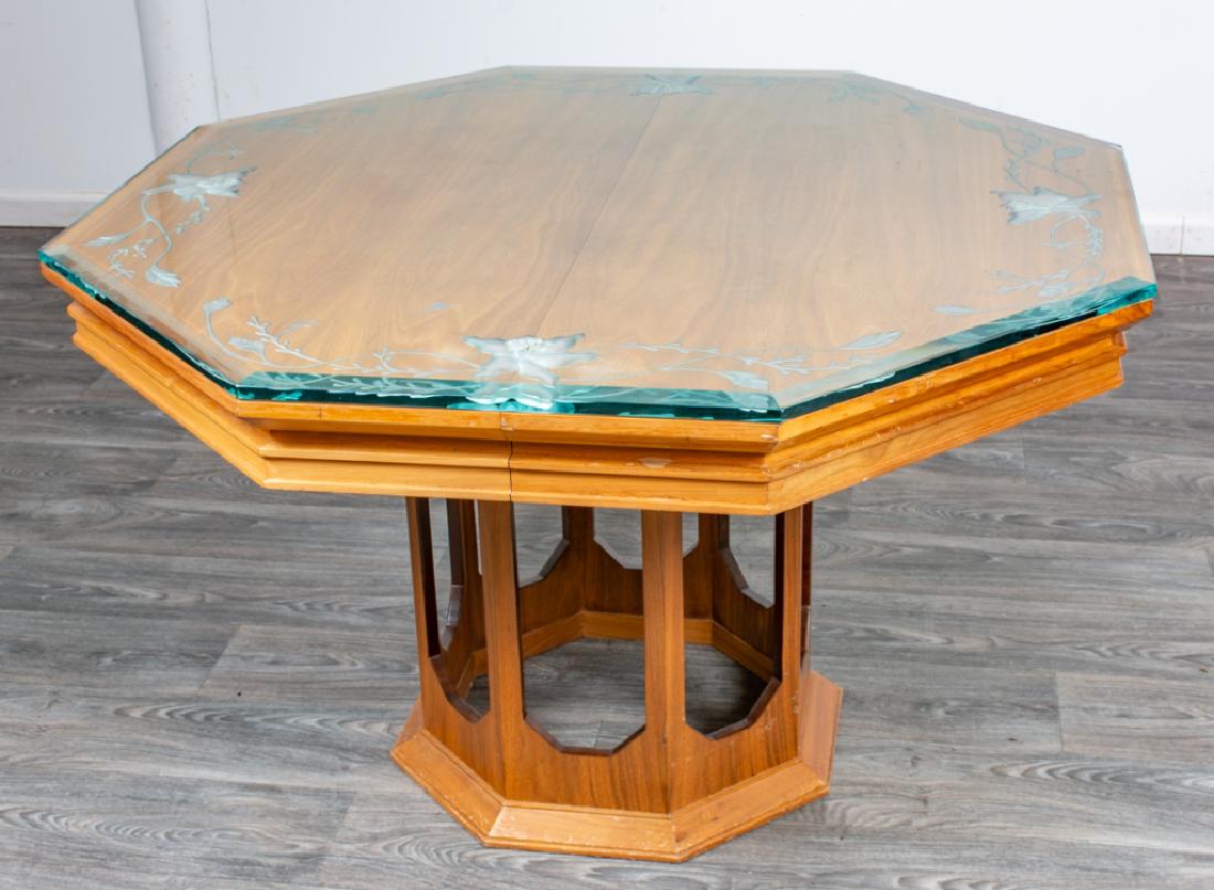 Harvey Probber Style Dining Table: Octagonal top dining table having a heavily carved glass top and an open work pedestal base, in the style of Harvey Probber. In overall good condition consistent with age and use. Measures approximate