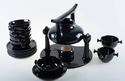 Luigi Colani Zen Stoneware Tea Set Circa 1970s: Ceracron black glazed stoneware tea set by designer Luigi Colani for Friesland Melitta, Germany circa 1970s. Set has seventeen pieces including one teapot, one warming stand, six cups with saucers to