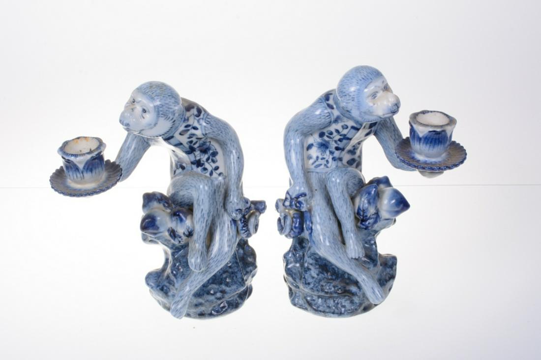 Chinese Blue & White Porcelain Candle Holders: Pair of Chinese blue and white porcelain monkey figure candle holders. Marked to the bottom. Measure approximately 10" high, 4-1/2" wide, and 8" deep. All sales are subject to Bremo Auctions Terms & C
