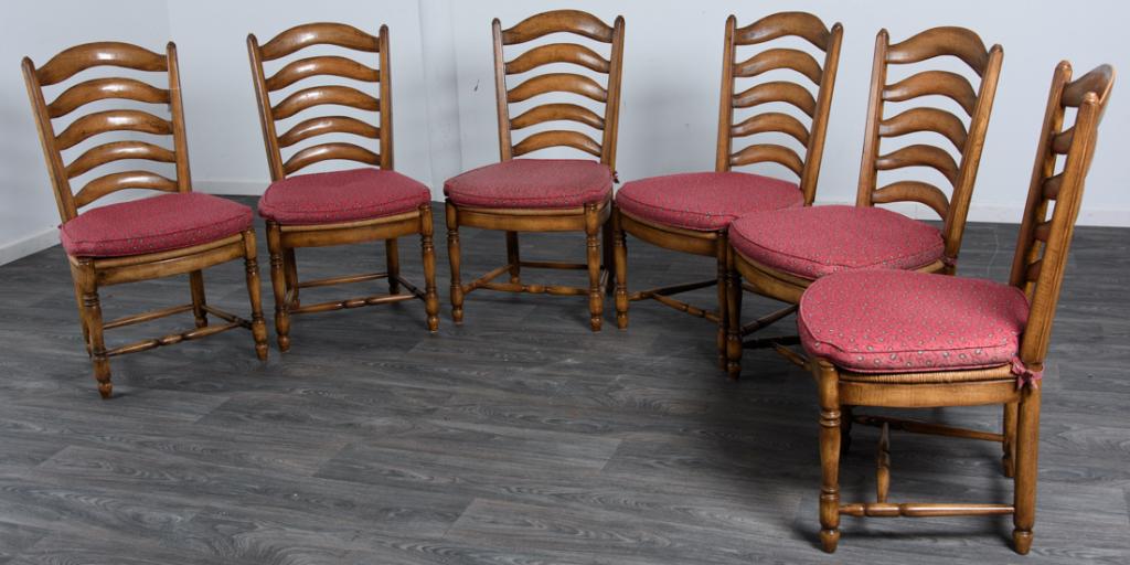 Six L19th / E20th Century French Side Chairs: Six Oak French side chairs with curved (ladders) to the backs, rush woven seats and turned legs and stretchers. In overall good condition consistent with age and use. Measures approximately 39-1/2" hi