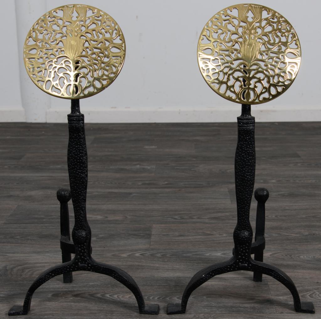 Harvin Virginia Metalcrafters Andirons: Pair of cast iron andirons topped with pierced brass medallions. Marked Harvin and 1039. Measure approximately 25-1/4" high, 12-3/8" wide, and 7-3/4" deep. All sales are subject to Bremo Auctions Term