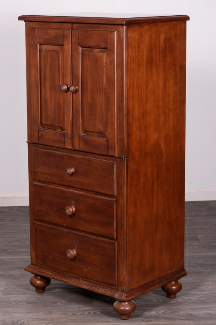 Ethan Allen Gentleman's Chest: Having two doors with shelf behind over three drawers, all with wood pulls. In overall good condition consistent with age and use. measures approximately 52-1/2" high, 25-1/2" wide and 18" deep. All s