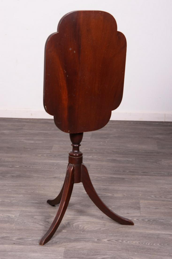 Mahogany Hepplewhite Style Tilt Top Candlestand: Mahogany Hepplewhite Style Tilt Top Candlestand with shaped Type Turned Shafts and Resting on Saber legs. In overall good condition consistent with age and use. Measures approximately 30-1/2" high, 22