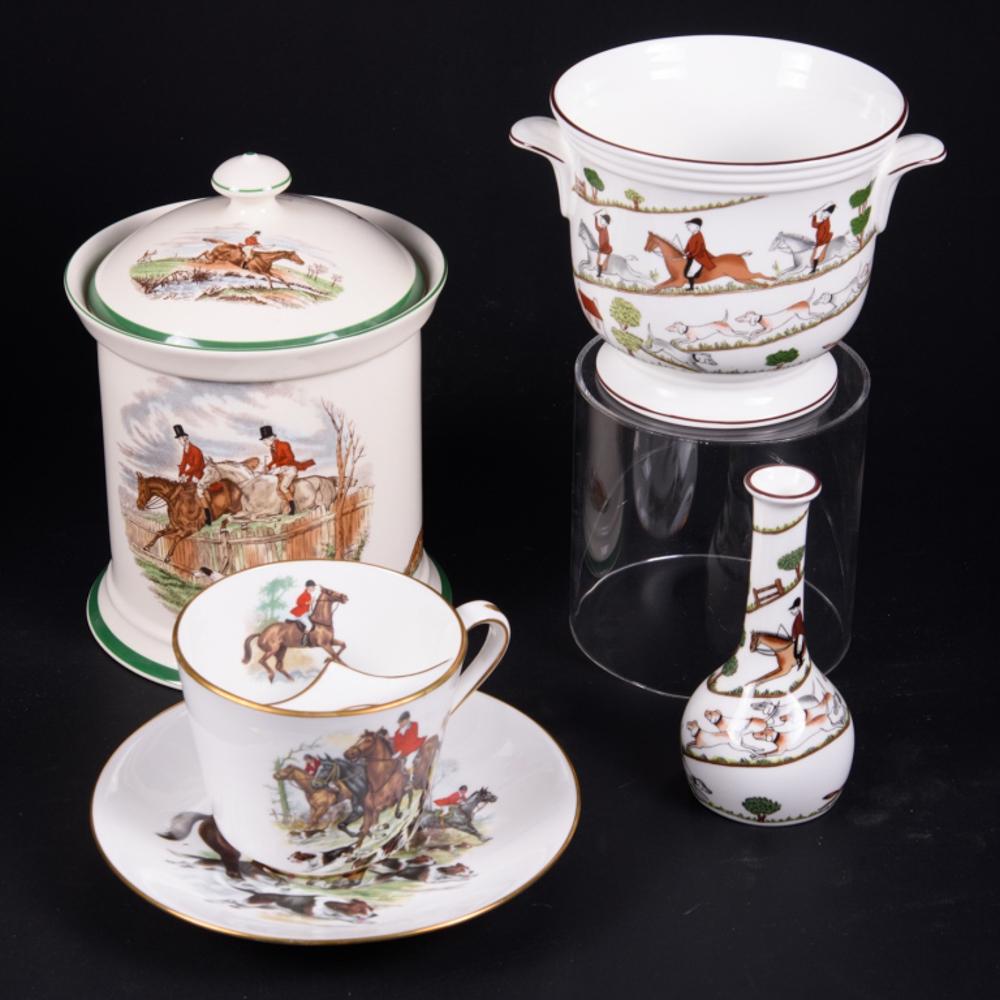 Four Hunt Themed Porcelain Items: Large moustache cup and saucer by Hammersley, cookie jar by Spode and a bud vase and cache pot by Coalport. From the Estate of Dr. R. H. Woodward and Lucy Spotswood White Waesche. Cookie jar 9" high A