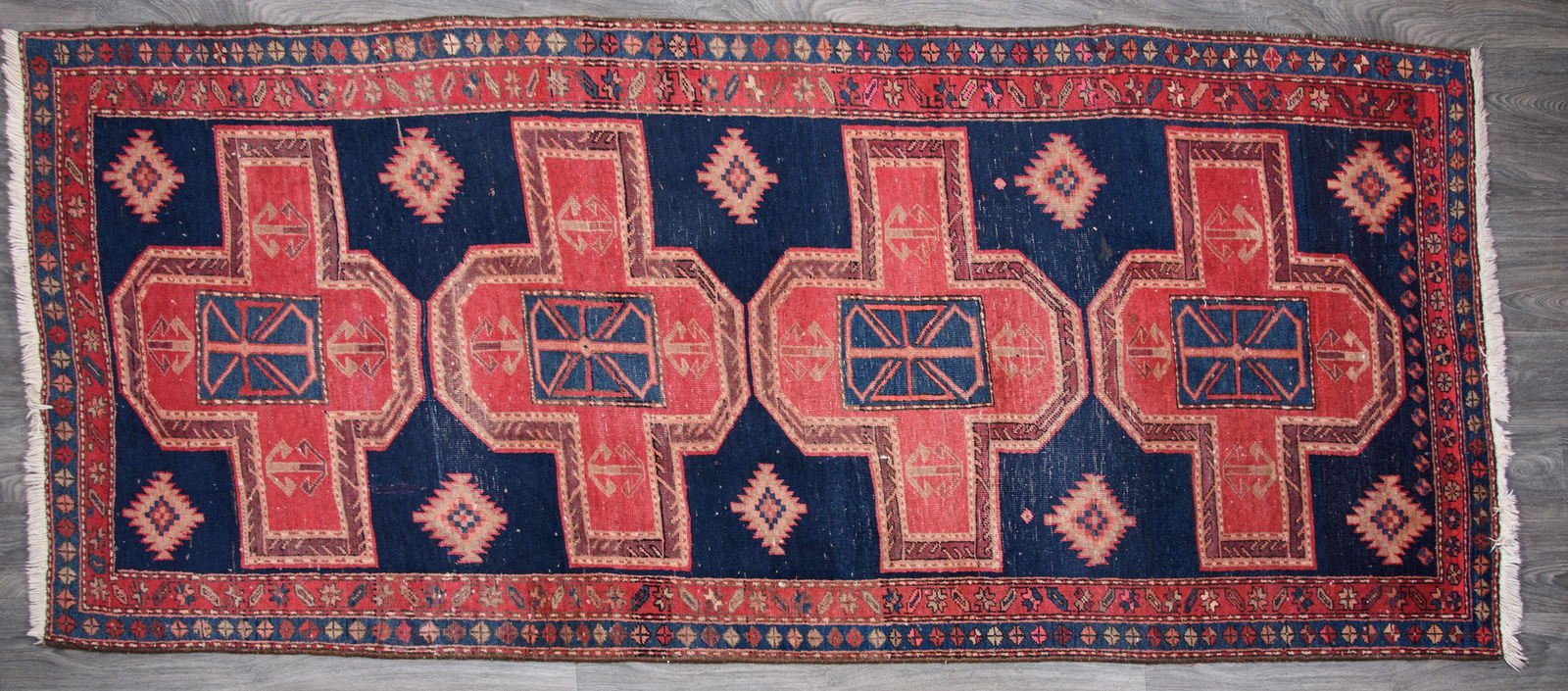 Semi Antique Persian Rug: Measuring approximately 10'-4" long and 4'-3" wide. From the Tucker, Harrison, Smith Collection of Eleanor Forsyth. Condition consistent with age and use.All sales are subject to Bremo Auctions Terms