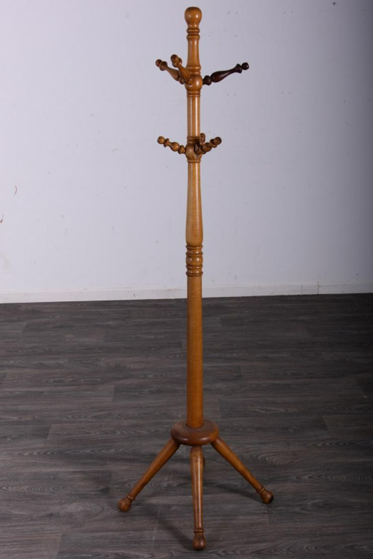20th C Maple Coat Stand: Maple coat stand with turned column pegs and legs. Measures approximately 65-1/2" high.All sales are subject to Bremo Auctions Terms & Conditions. Please review before bidding.