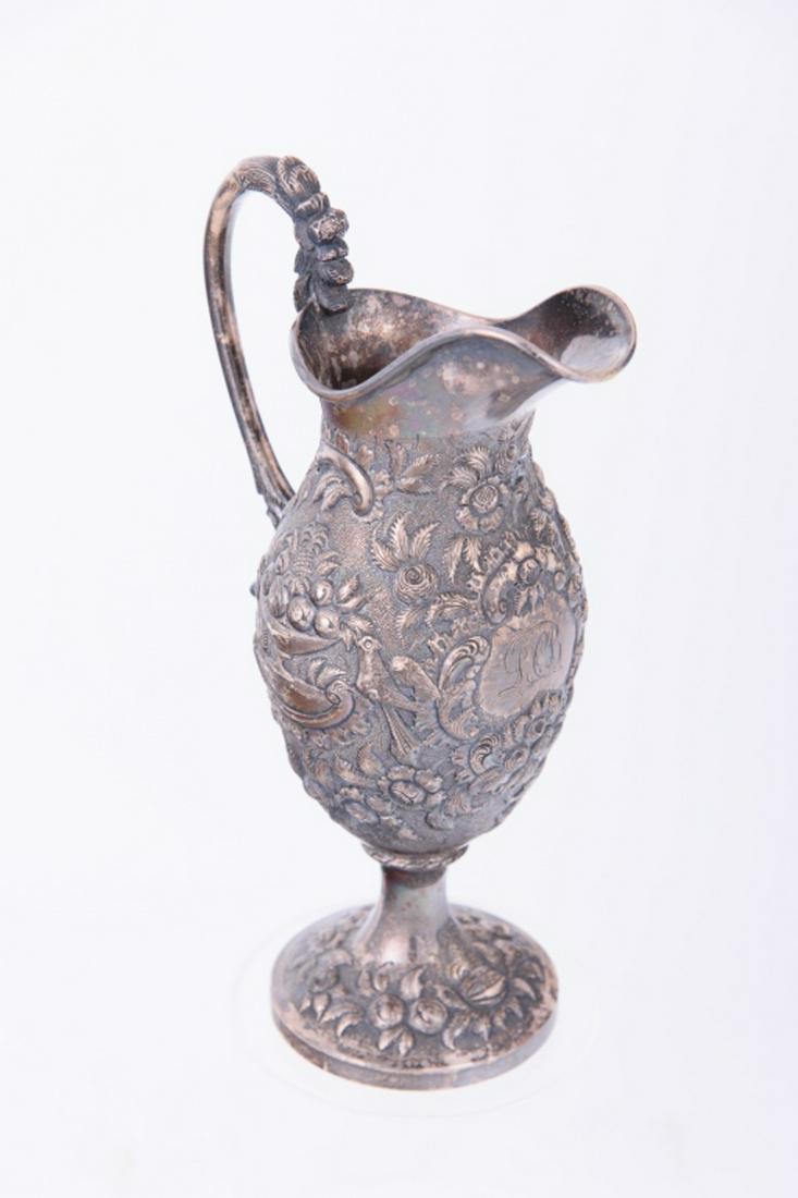 A. E. Warner Coin Silver Cream Jug: Marked A. E. Warner, (Andrew Ellicott Warner, Baltimore, L 18th - E 19th C). Heavily repoussed and monogrammed LCB. Descended in the Harrison Bucker and Smith Families of UVA. From the Tucker, Harriso