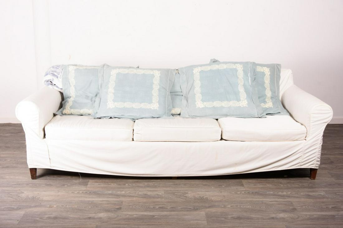 Sofa with White Slipcover: Sherrill upholstered sofa three cushion sofa by Sharrill Hickopy, NC with multicolored upholstery. Measures approximately 30-1/2" high, 96" wide, 36" deep.From the private collection of Roulhac Toleda