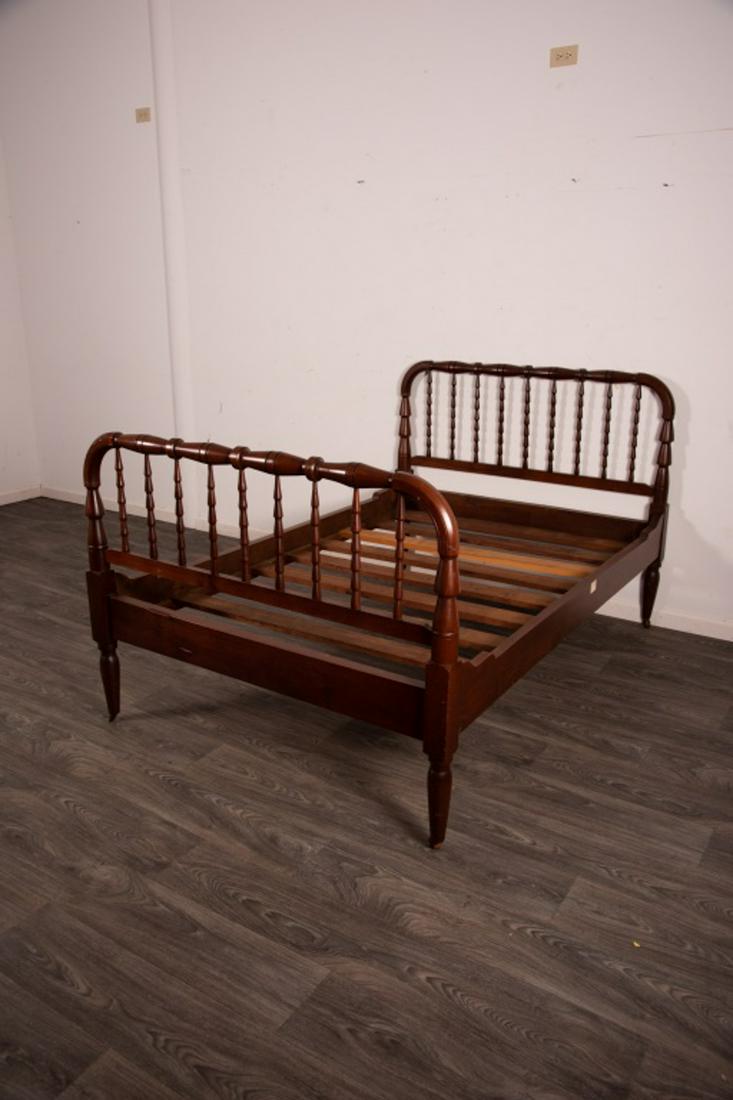 Dark Finished Double Bed: With turned spindle and roll headboard and turned cone form posts. Measures approximately 43" high and 51" wide.All sales are subject to Bremo Auctions Terms & Conditions. Please review before bidding