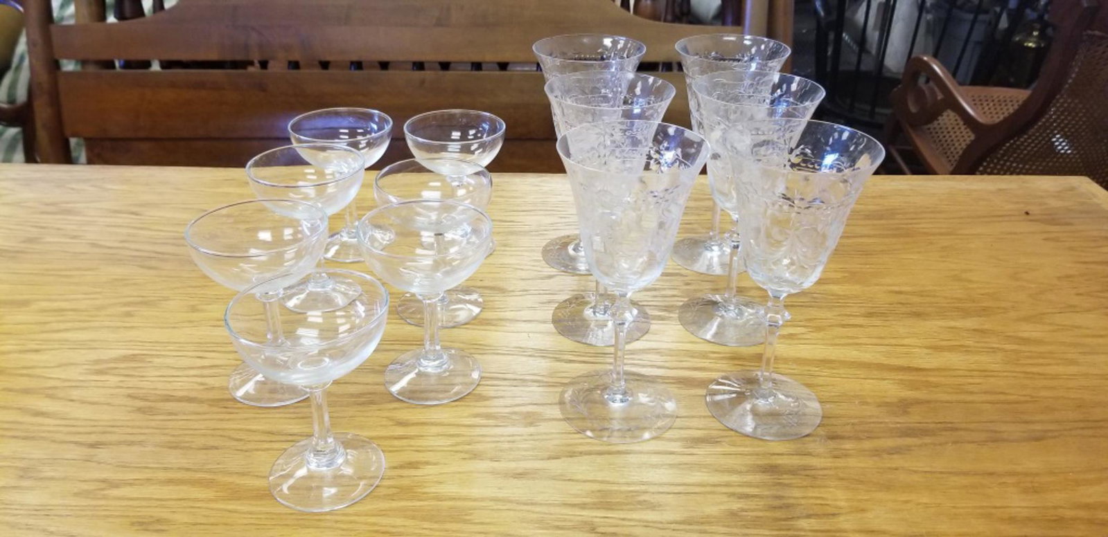 Crystal Wine and Champagne Glasses: Six etched crystal wine glasses (some chips) and seven champagne glasses. All sales are subject to Bremo Auctions Terms & Conditions. Please review before bidding.