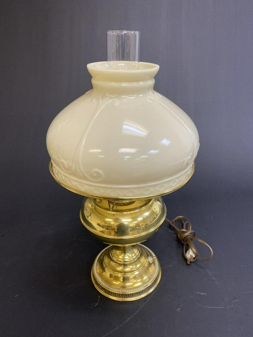 Rayo Brass Lamp with Custard Glass Shade: Measures approximately 17-1/2" high and 10-3/8" in diameter. All sales are subject to Bremo Auctions Terms & Conditions. Please review before bidding.
