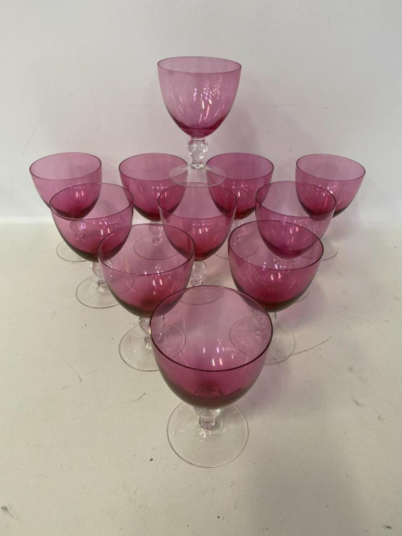 Cranberry Crystal Wine Glasses: Eleven. No chips or cracks. All sales are subject to Bremo Auctions Terms & Conditions. Please review before bidding.