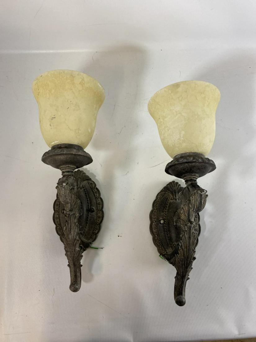 Pair of Electric Wall Sconces: Painted acanthus scroll holders with textured ivory shades. Measures approximaltey 17"Long, 6" wide, and 9-1/2" deep. All sales are subject to Bremo Auctions Terms & Conditions. Please review before b