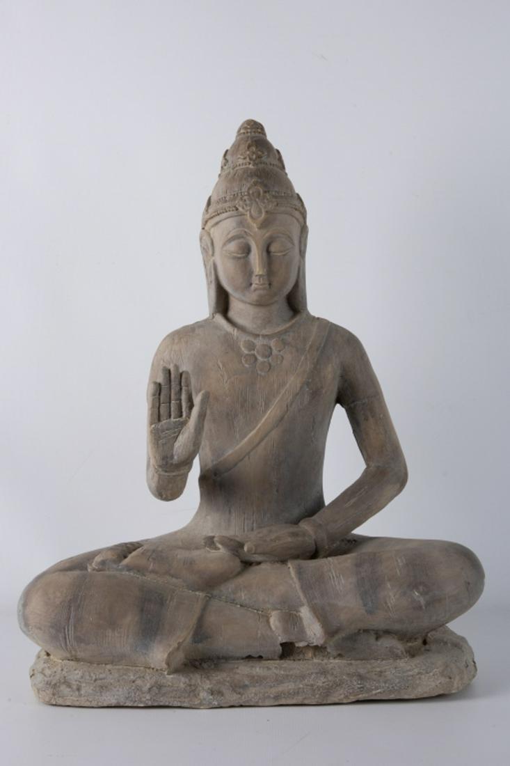 Plaster Buddha Figure: Plaster Buddha figure seated with upraised hand. Gray patina. Unsigned. Measures approximately 20-1/4” high.All sales are subject to Bremo Auctions Terms & Conditions. Please review before biddi