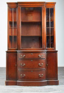 Landstrom Mahogany Bow Front China Cabinet: Mahogany bow front china cabinet by Landstrom Furniture, the top having a center glass door flanked by glass panels, the door opening to a shelved interior with plate grooves. The base having a bow fr