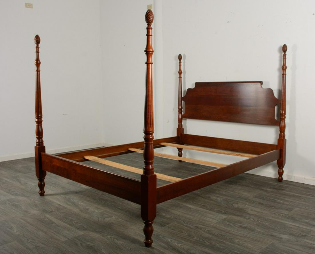 Pineapple Poster Bed: Poster bed having a shaped headboard and a flat foot rail, turned posts with pineapple finials. In good overall condition consistent with age and use. Measures approximately 61-3/4" high, 60-1/2" wide