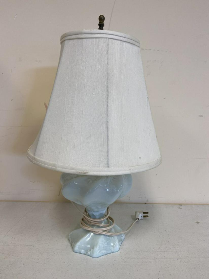 Milk Glass Oil Lamp: Converted to electric. Base intact. Rose motif. Measures approximately 19" to the top of harp and the shade is 12" in diameter. All sales are subject to Bremo Auctions Terms & Conditions. Please revie
