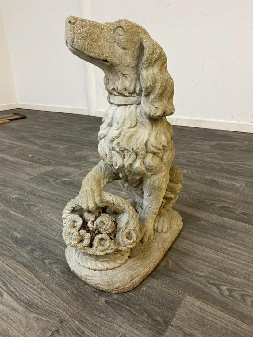 Dog with Flower Basket Lawn Ornament: Made of concrete. Measures approximately 25" high, 10-1/2" wide and 15-1/2" deep.All sales are subject to Bremo Auctions Terms & Conditions. Please review before bidding.