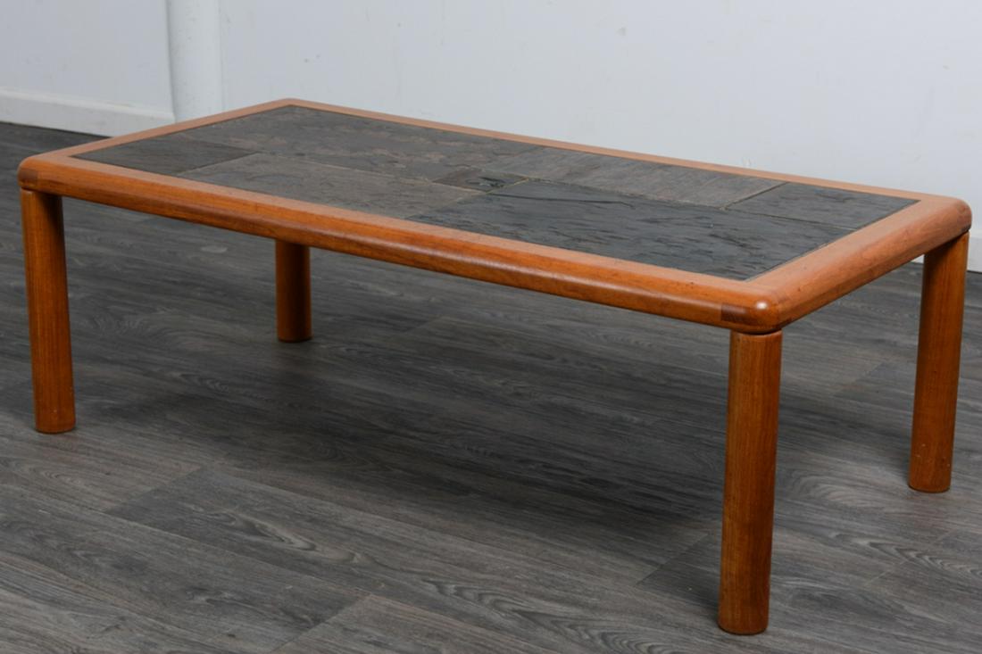 Mid Century Teak Danish Coffee Table: Mid century Danish coffee table with an inlaid slate tile top. Made by A/S Haslev Mobelsnedkeri. In overall good condition consistent with age and use. Measures approximately 16-1/4' high, 48' wide, 2