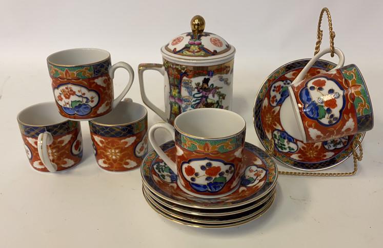Chinese Porcelain China Group: Five cups and saucers and lidded tea/coffee pot with hand painted of flowers and figures. Character marks to the bottom. Pot measures approximately 6" high.