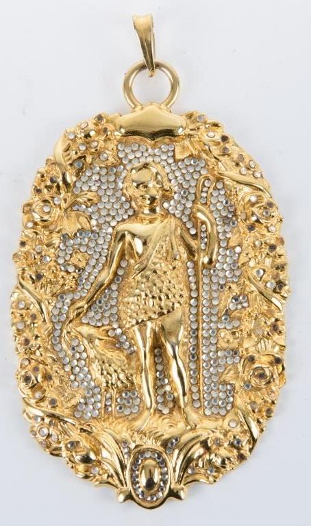Judith Leiber CZ & Gold Tone Pendant: Gold tone pendant created by Judith Leiber, a name synonymous with elegance, style, and sophistication for more than fifty years; depicts St. John the Baptist; an intricate foliage pattern frames the