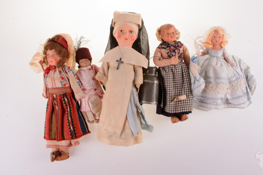 Kimport and Nancy Ann Storybook Doll Group: Kimport doll group to include a selection of authentic imported international dolls in traditional hand crafted dress from the lands they represent. With one Nancy Ann Story Book doll wearing a blue d