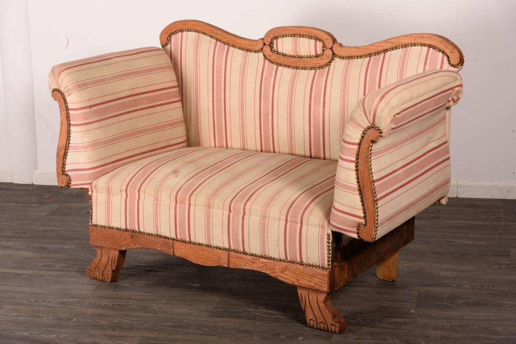 Striped Loveseat: Striped upholstered loveseat with one side of loveseat arm comes down. Measures approximately 35" high, 54" wide and 27" deep. From the private collection of Roulhac Toledano, noted author, historian,
