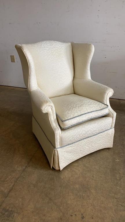 Wingback Chair: White upholstery with skirt. Measures approximately 38" high, 30" wide and 28" deep.