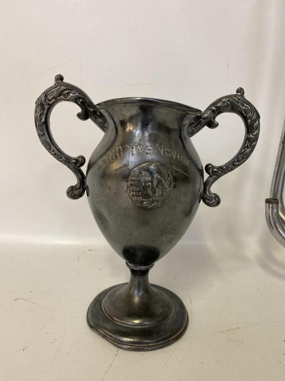E 20th C Trophy and Boy Scout Bugle: Trophy is inscribed 600 YDS Novice, indoor games, Poly Prep 1908 with mark to bottom. Some dents. The Boy Scouts of America official bugle is marked Rexcraft to the side. Bugle needs repair.