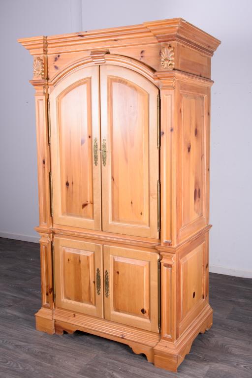 Pine Media Cabinet: With two doors to the top opening for a television and a single drawer for storage. Two doors to the bottom opening to shelves. With key. In overall good condition consistent with age and use. Measure
