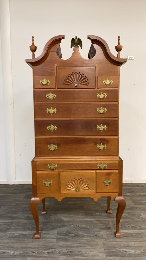 Chippendale style Chest on Chest: Bench crafted of mixed woods with oak and other secondaries. Having a broken scroll pediment to the top with urn form and brass eagle finials. The top section has three over four graduated drawers, th