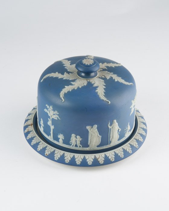 A Blue Wedgwood Jasperware Cheese Dome & Plate: With Grecian and acanthus leaf decoration. Height: 7 1/4"