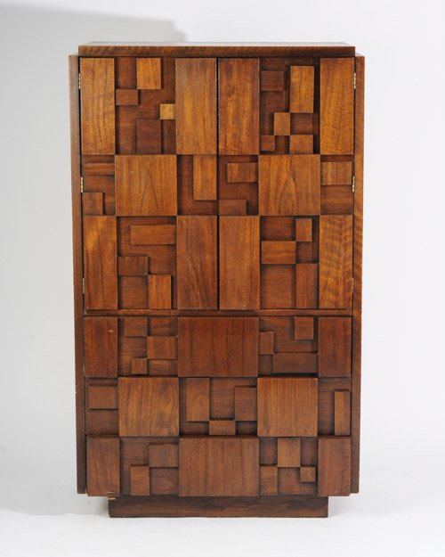 Lane Brutalist Style Armoire: In the style of Paul Evans. Having two doors encasing four shelves over three drawers.Height: 64"Width: 38"Depth: 18-3/4"