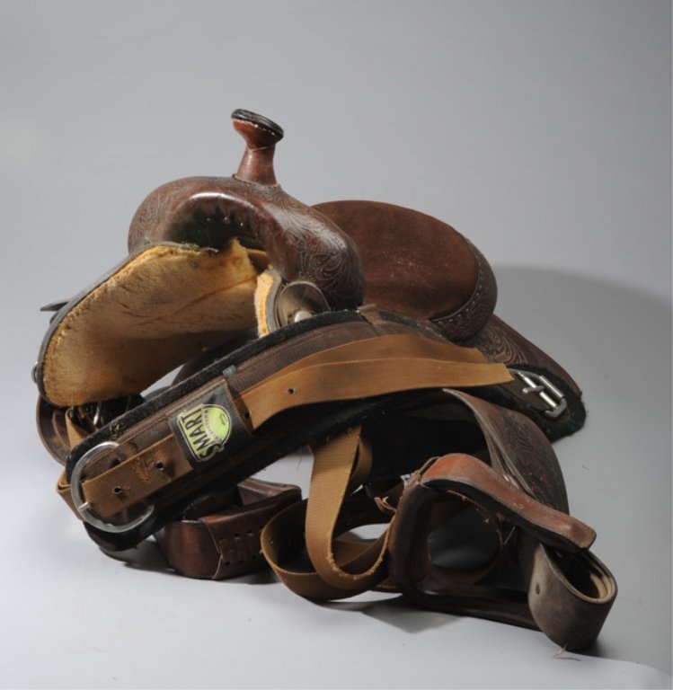 Circle Y Western Saddle: Western Circle Y Brand Yoakum Texas Saddle, a square skirted saddle, fender and stirrups allover with leafy design, fitted with Belvins Buckles, Wheatland, Wyoming.