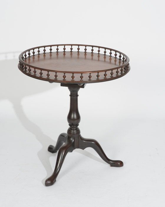 18th C. English Mahogany Tilt-top Tea Table: Top having a turned spindle and rail galley. Height: 30-1/2" Diameter: 28-1/2"