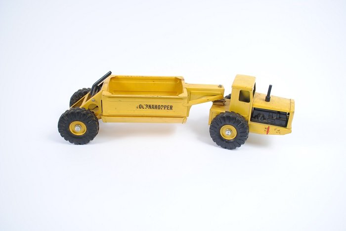 Yellow Tournahopper Dump Truck: Nylint Tournahopper bottom dump tractor; 22" long,5 1/2" wide,6" tall; bottom dump bed functions.