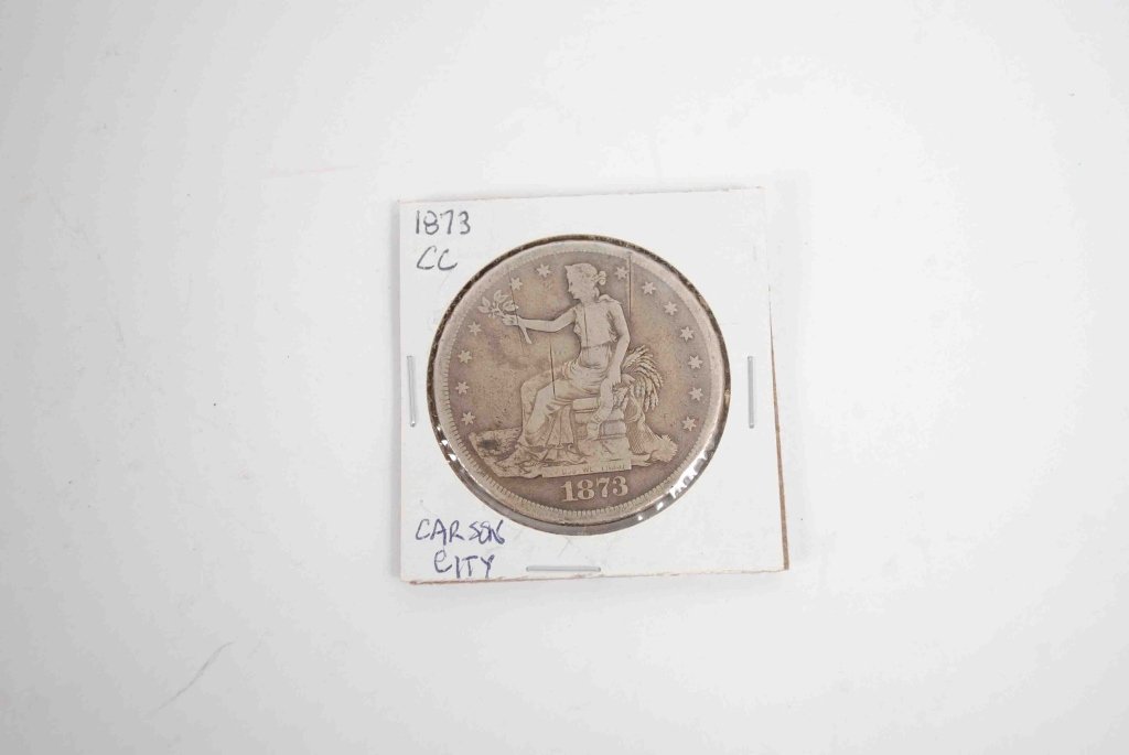 1873 CC Trade Dollar: Hard to find Carson City with some cuts but otherwise a nice original coin. Many Trade Dollars made their way to China, and they were used as trading currency there. Designer: William Barber. Diameter