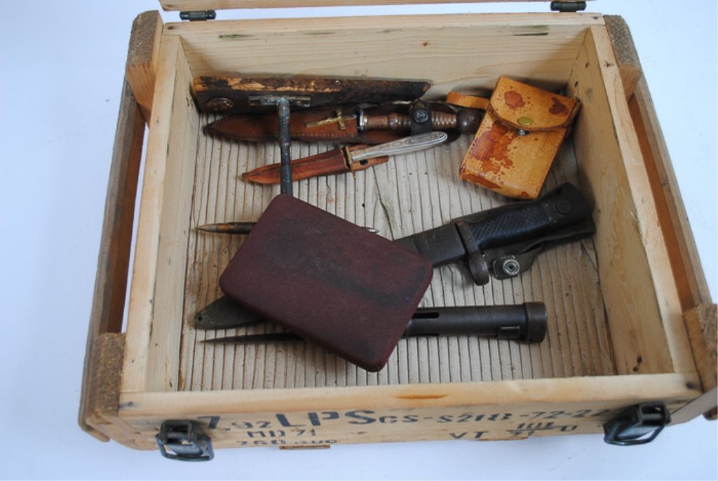 Ammo Box with Collection of Items: To include belt buckle, binoculars, 3 knives, 1 trench art cross, and a bayonet.